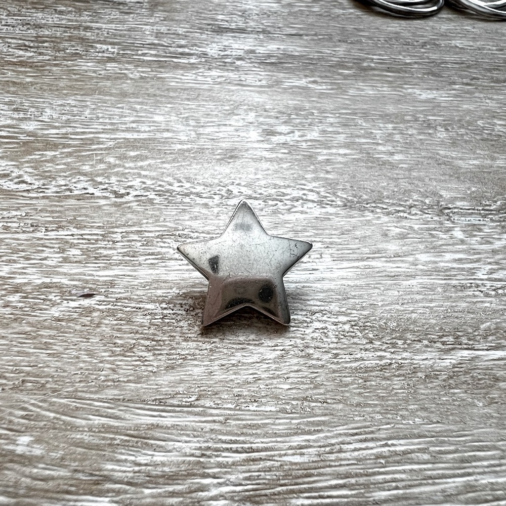 Retired James Avery Star charm. Gently worn.